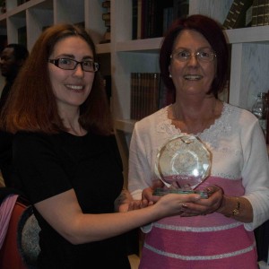 Sharon Slater presenting the Overall Tidy Town Award of 2014 to C O' Neil Fruit and Veg Shop.