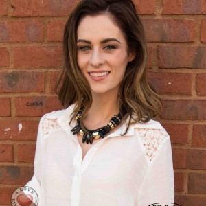 Madeline Mulqueen modeling a necklace from Glitzi Bitz.  