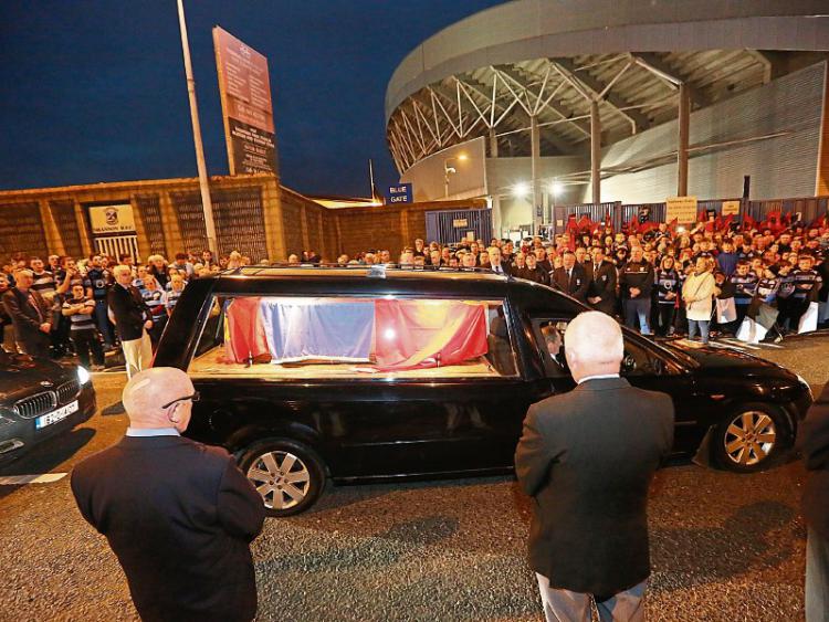 Huge crowds turn out at Thomond to greet the Anthony Foley funeral procession on its way past Thomond Picture: Press 22