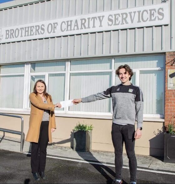 Newcastle West GAA club member Cian Sheahan pictured above with a representative from the Brothers of Charity