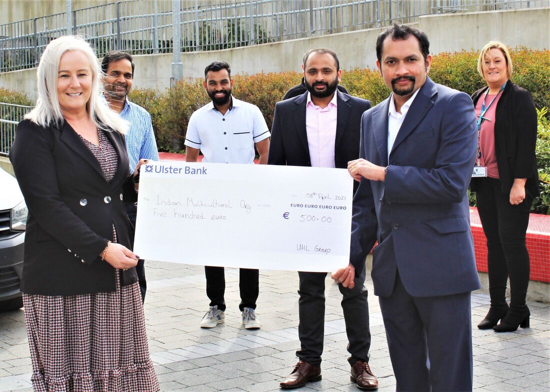 Colette Cowan, CEO, UL Hospitals Group, presents a cheque to Jose Lukose, Munster Indian Cultural Association (MICA). Also pictured are (centre, from left) Babu Baskaran, Nishad Badarudeen, and Lino Varghese (MICA); and (back, from left) Niall Joyce, UL Hospitals Group (partially obscured); and Linda Fahy, UL Hospitals Group.