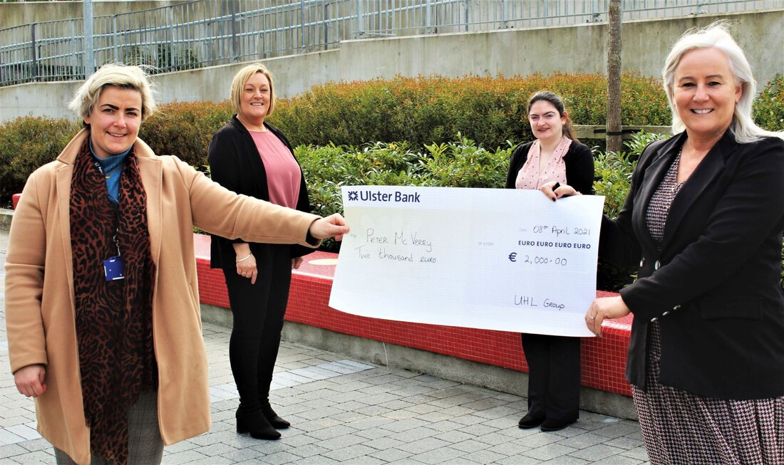 Colette Cowan, UL Hospitals Group CEO (front right) presents Nicola Sweeney of the Peter McVerry Trust, watched by (back, from left) Linda Fahy and Eilís Power, UL Hospitals Group.