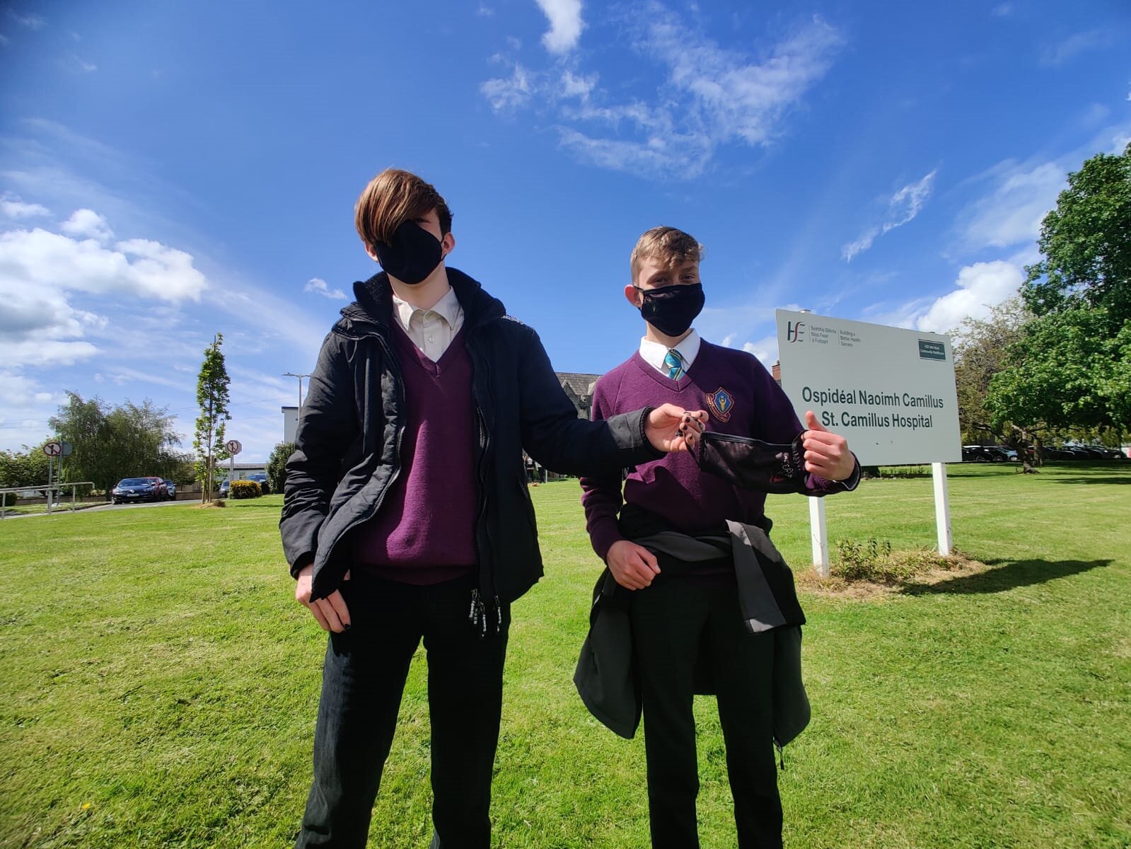 Transition years students proudly holding one of their own uniquely designed and Thomond CC themed face masks.