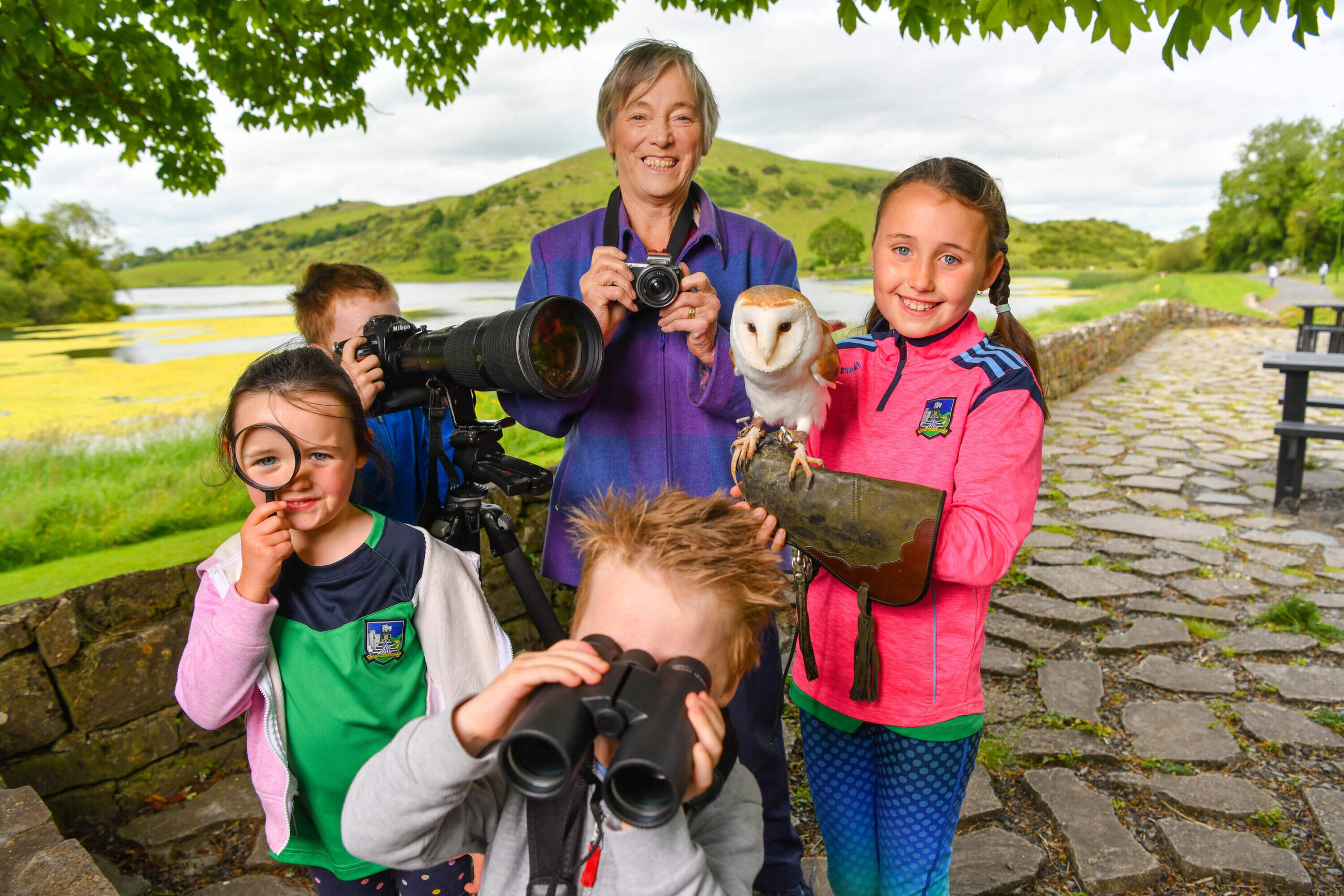 TLC Biodiversity Photography - Meaghan, aged 5, Alex, aged 8, Leo, aged 4, and Anna Fennessy, aged 9, from Pallasgreen, Co Limerick, with a barn owl at Lough Gur on Monday 21st June for this year’s Summer Solstice and to launch Team Limerick Clean-Up’s (TLC) biodiversity competition. Picture: Diarmuid Greene.