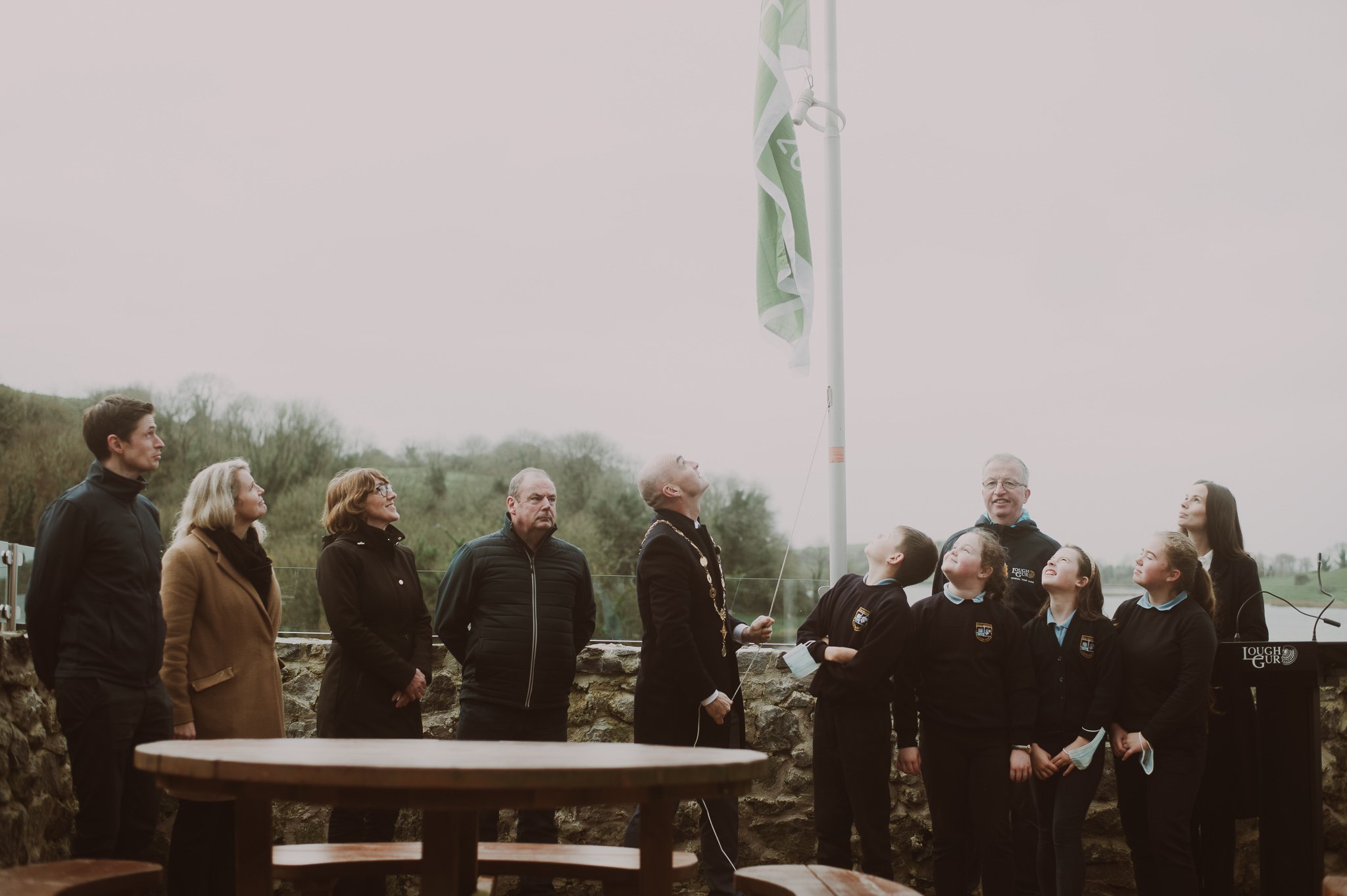 Lough Gur Green Flag - Pictured at the raising of the Lough Gur Green Flag is L-R Gavin Sheehan, Nuala Gallagher, Carmel Lynch and Donie Coffee all from Limerick City & County Council, Mayor Daniel Butler, (FR) Lough Gur National School Students, (BR) John Carew and Kate Harrold.