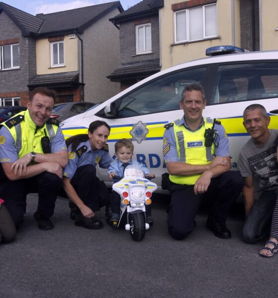 Una Quish (far left) pictured in 2019 with Gardai and family, provides round-the-clock care for her son, four-year-old Noah.