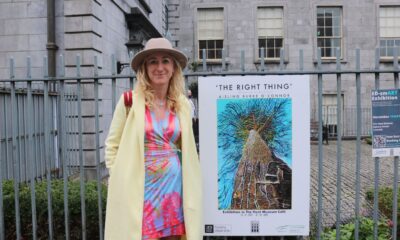 Aisling Burke O Connor with a poster for her exhibition ‘The Right Thing’ outside The Hunt Museum