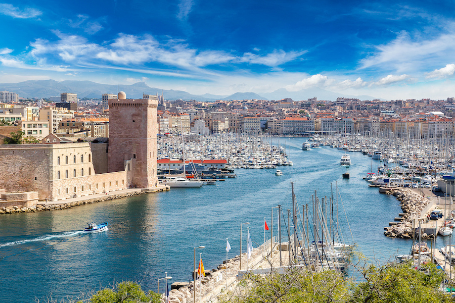 Ryanair Shannon to Marseille routes a boost for the Mid-West. Saint Jean Castle and Cathedral de la Major and the Vieux port in Marseille, France with blue skies overlooking a blue river.