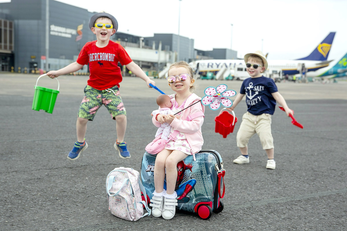 Shannon Airport summer schedule - Jumping for joy are brothers Matthew (7) and Ross Curran (5) from Kilmallock Co Limerick with 3 year old Sienna Mullally from Castletroy Limerick. Picture: Arthur Ellis.