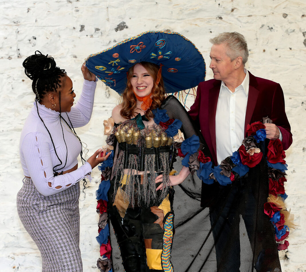 2022 Junk Kouture competition judges Soulé and Louis Walsh with Villiers student Leah Gow with her design Culchie Life pictured above. Photo by Brian McEvoy.