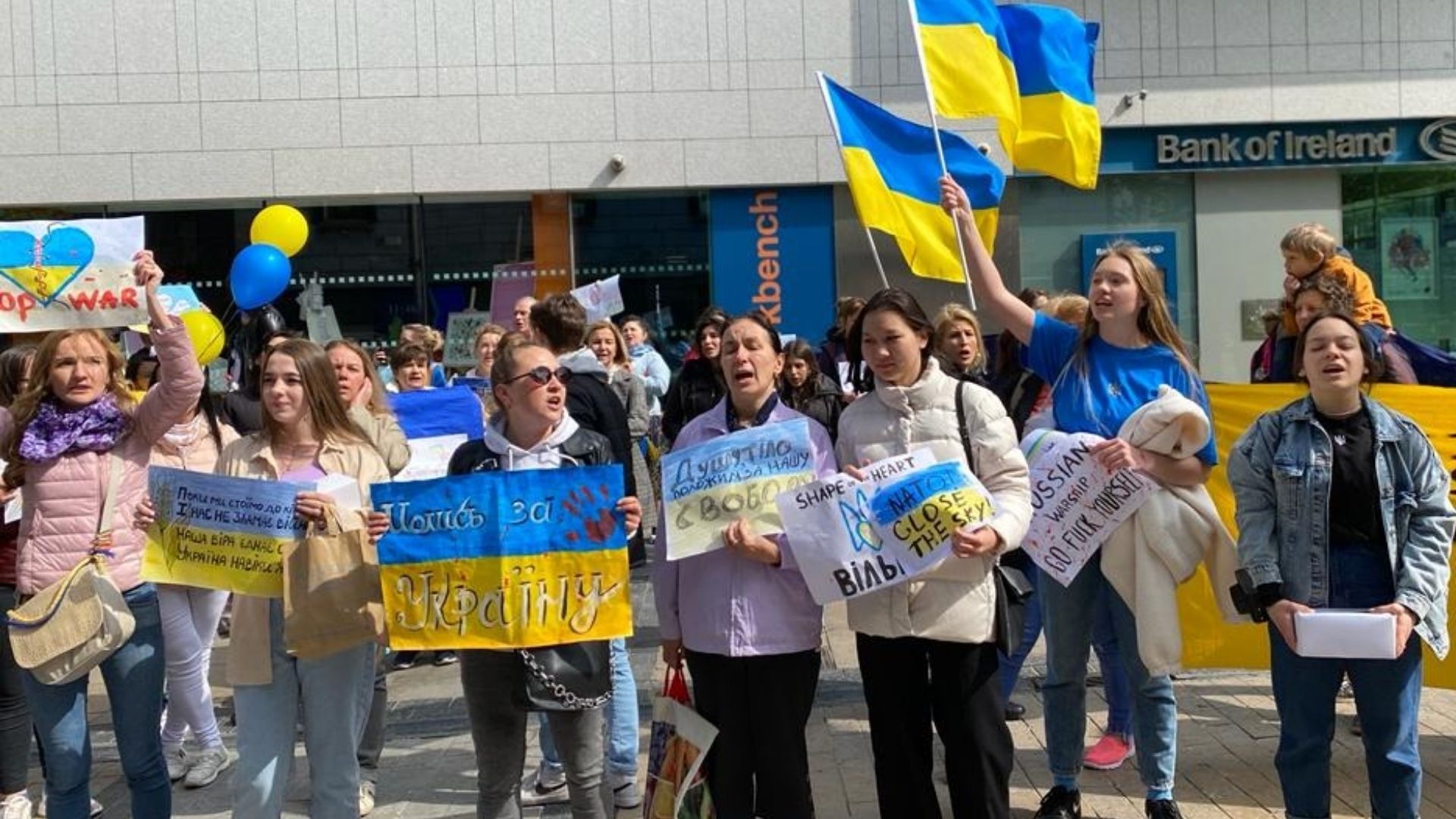 Ukrainian banners - Ukrainian refugees in Limerick marked Easter Sunday by painting two 40-foot banners in the vibrant blues and yellows of their national flag to call for peace in their homeland.