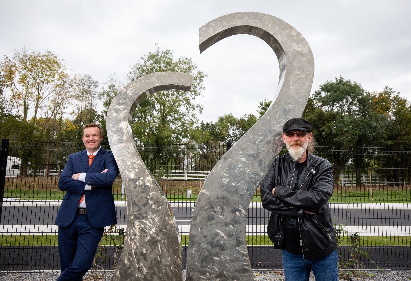 JJ Hegarty - The sculpture consists of two stainless steel pieces of work placed together to create a heart.