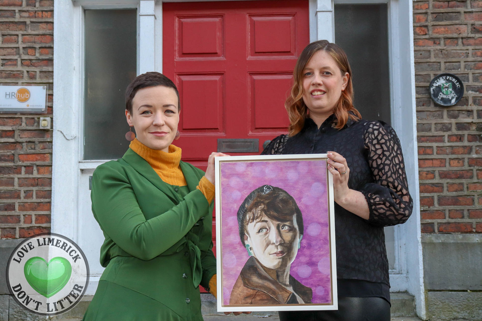 Creating Connections portrait exhibition - Emma Langford pictured above with her portrait by artist Aoife Carroll. Picture: Ava O'Donoghue/ilovelimerick.