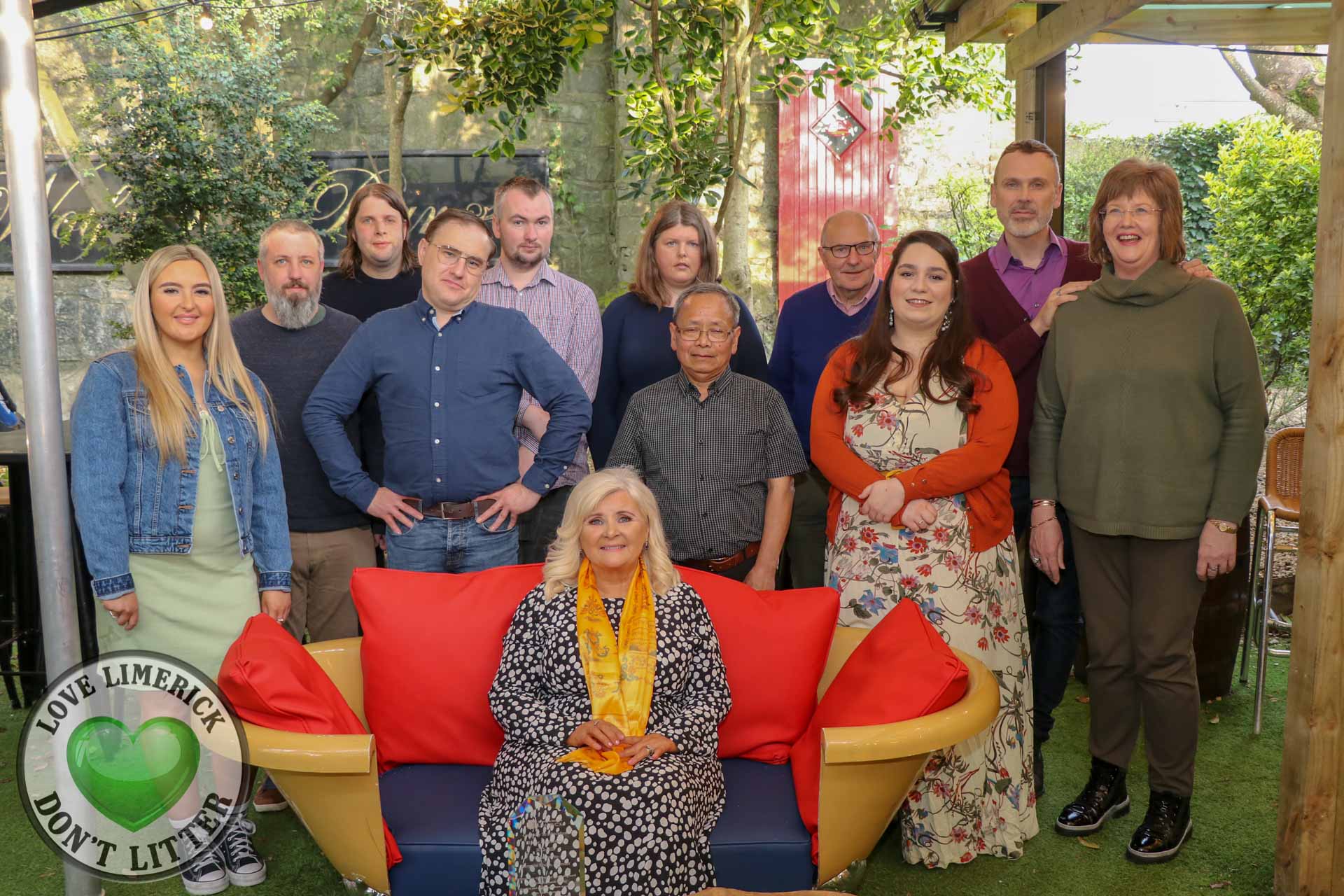 LGTE 10th anniversary - Suzanne Roche, Founder of LGTE (seated front) surrounded by family, friends and volunteers at the event at Bobby byrnes. Picture: Ava O' Donoghue/ilovelimerick