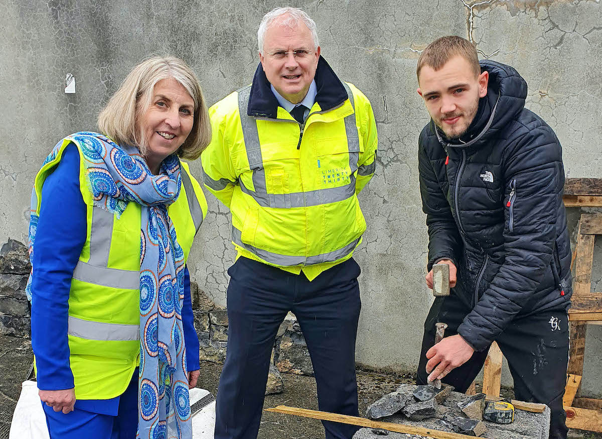 Opera Square sustainability programme - Marcus McCarthy, Old Cork Road, Limerick, an apprentice block-layer and stonemason working with stone recycled from the Limerick Twenty Thirty (LTT) Opera Square site. Also in picture are David Conway, Chief Executive of LTT and Philippa King, Coordinator with the Southern Region Waste Management Office