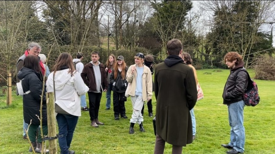 Otherworld exhibition - student pictured above preparing for the exhibition at Ballinacourty House gardens