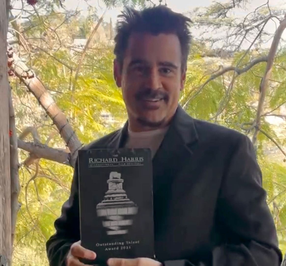 Colin Farrell pictured above with his award