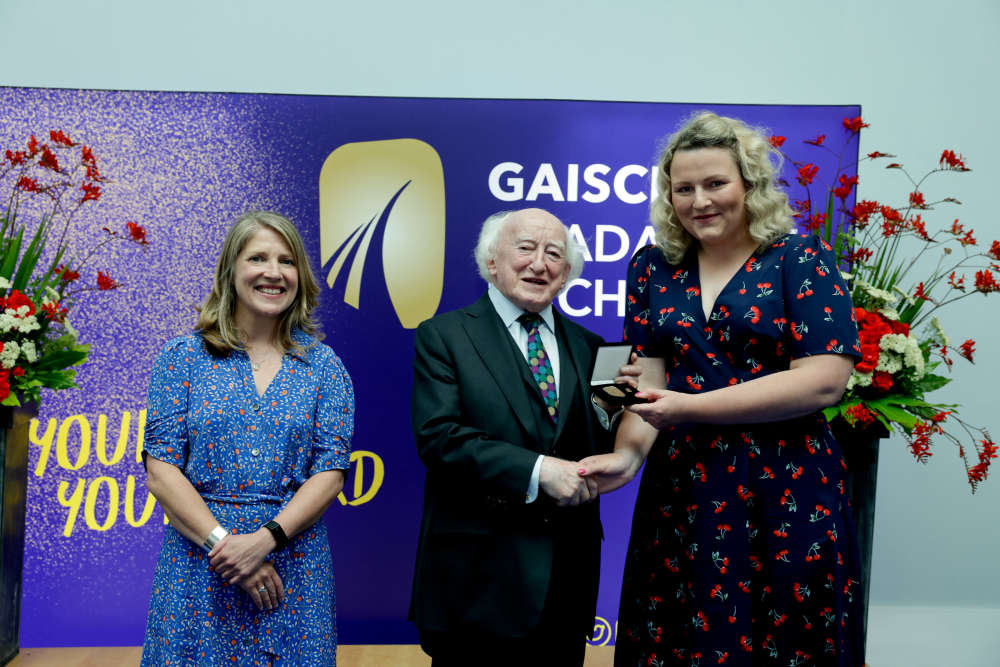 Grainne Ni Dhuinnin (far right) receiving her medal from President Michael D Higgins. Photo: Hanover Communications.