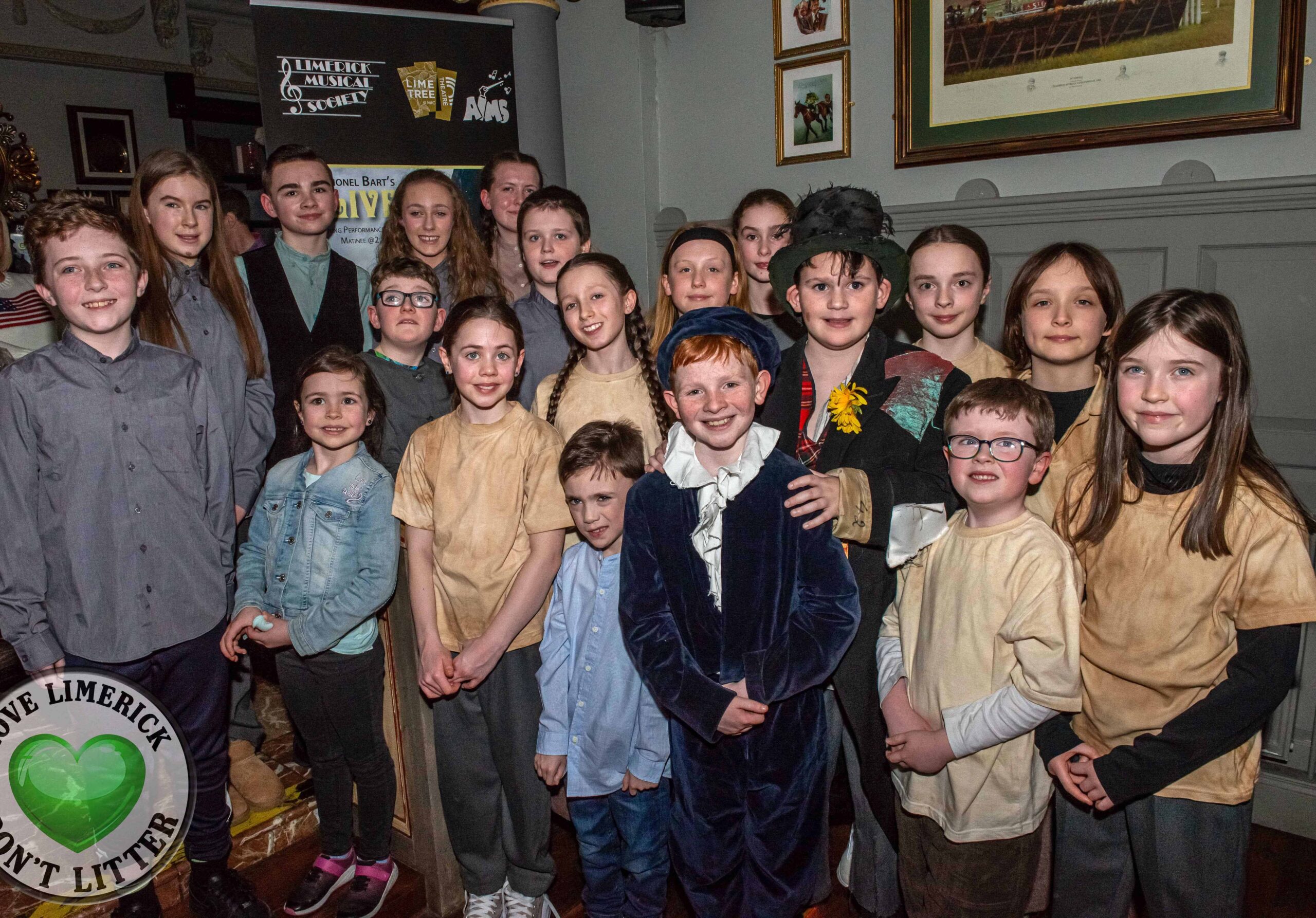 Sean O' Callagahn who plays Oliver and AJ McGuane who plays the Artful Dodger with members of the young cast