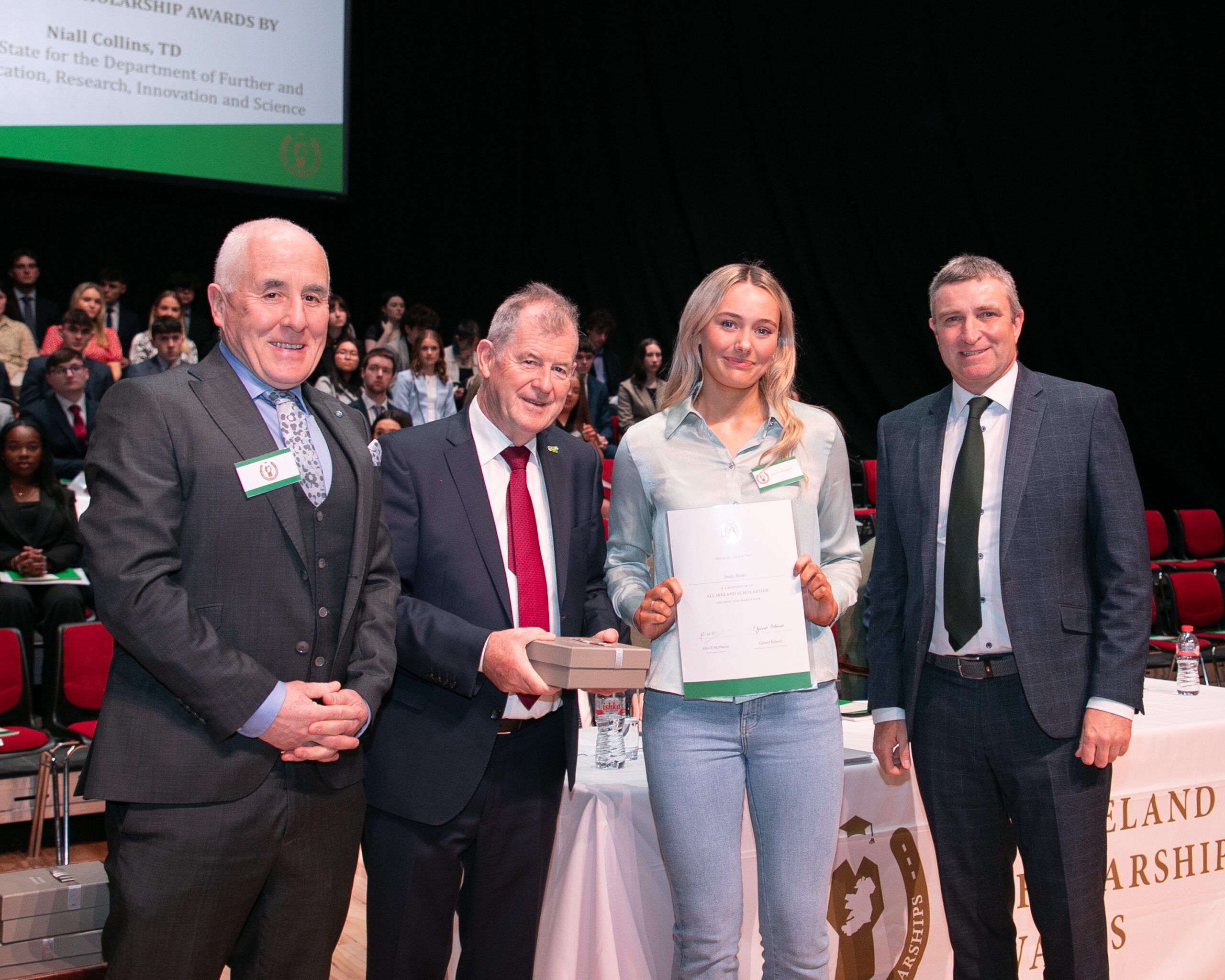 Sponsor JP McManus and Niall Collins, Minister of State at the Department of Further and Higher Education, Research, Innovation and Science presenting All Ireland Scholarship Award to Holly Harte and Padraig Flanagan, Principal, Castletroy College, Limerick.