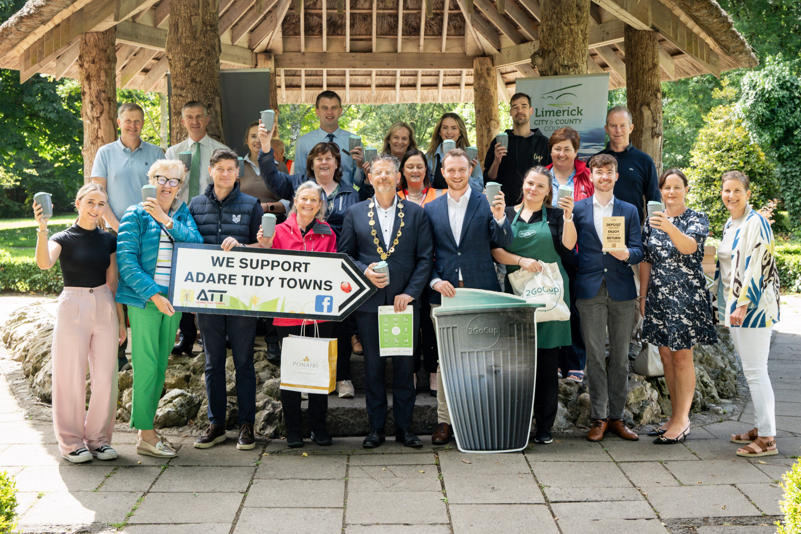 Businesses in Adare are preparing to ditch single-use paper cups as the County Limerick village embraces sustainability and the circular economy A reusable cup rental scheme is being rolled out across the village of Adare as part of the new 'Adare Green Business Hub' in what is a first for Limerick. Delivered by Limerick City and County Council's Envirnment and Climate Action Department, the Green Hub hopes to drive local action on the circular economy and climate action through fostering a community-led approach. The project is being delivered in partnership with the My Waste team, Adare Tidy Towns and the Adare Business Community. The initiative will primarily provide resources and support to local businesses looking to adopt more sustainable waste management practices, particularly waste prevention strategies, and improve waste separation within the 3-bin waste system. This will include promotion of the suite of FREE materials, developed by My Waste, which are available to the business community, including bin signage, posters, training animations, and testimonial videos. Mayor of Limerick John Moran welcomed what he described as a "tremendous community-led approach" to the creation of the Green Hub which he believes will "go on to have a positive impact on climate change". "In this modern world, Ireland is moving away from the traditional 'take-make-use-dispose' model towards a 'circular economy' regenerative growth model where resources are reused or recycled as much as possible and waste is minimised," said the Limerick Mayor, adding, "This transition is now essential to reduce pressure on the earth’s natural resources, aid in achieving climate targets, support Sustainable Development Goals and create sustainable growth and jobs.” Helen Kenneally, Environmental Awareness Officer with Limerick City and County Council is encouraging the business community to engage with the project, saying, “The www.mywaste.ie/business toolkit is a very clear, versatile resource which will assist the business community to standardise their waste bin labelling both within the premises and at the back door. This, in turn, will improve the separation of the waste generated on the business premises into the 3 bin system, and will help to prevent contamination of the waste streams. This is a positive climate action and will contribute to the circular economy. It is worthwhile for any business to spend some time browsing through the toolkit which is really user friendly.” The campaign will publicly recognise businesses which show their commitment to sustainability and invites them to book a one-to-one information session with a Limerick City and County Council waste advisor who will help identify simple changes to improve waste segregation and recycling in their businesses. With the assistance of Adare Tidy Towns and www.2gocup.ie, a reusable cup rental scheme is being introduced in Adare as part of the campaign in the hopes of reducing single-use waste.