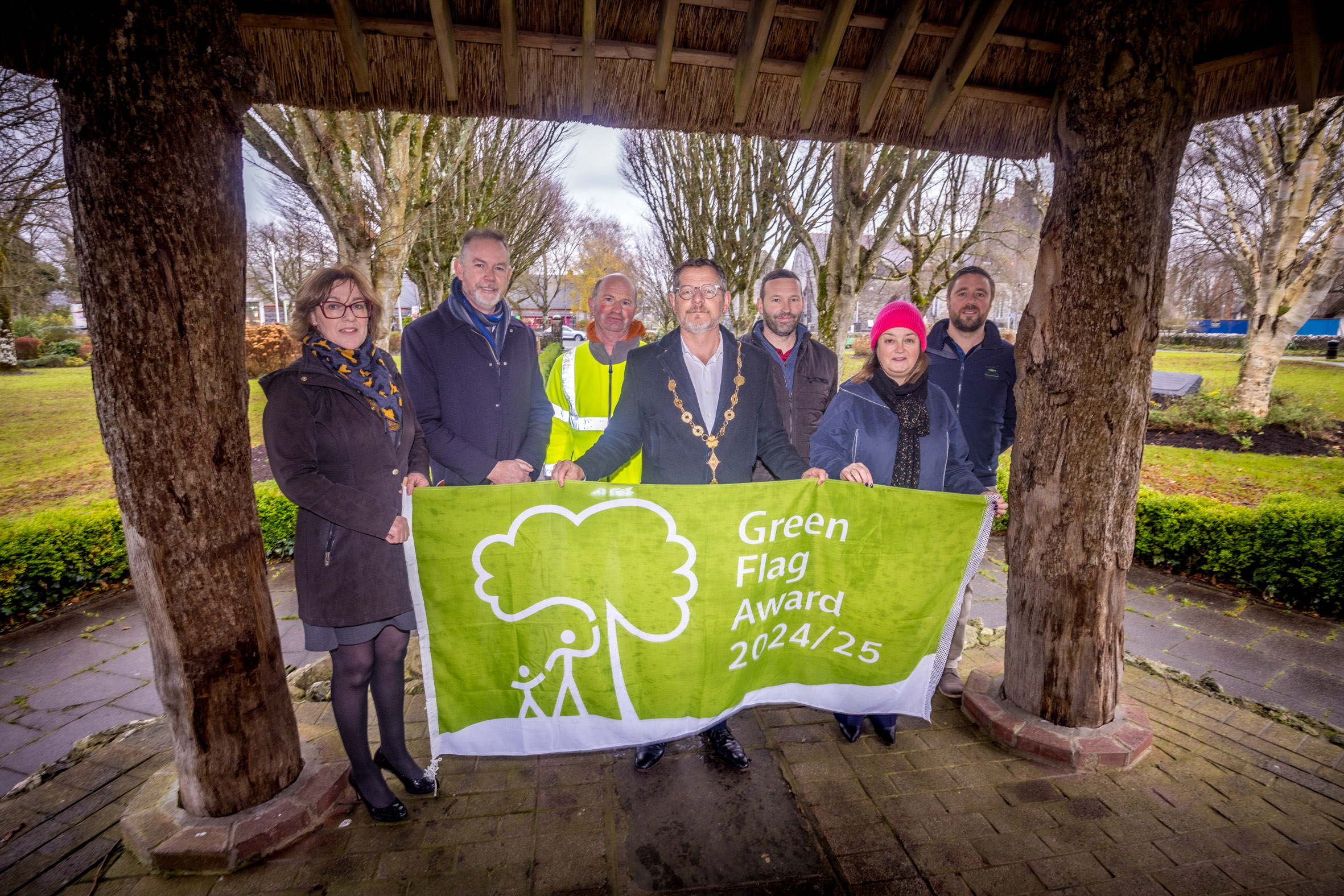 17-12-2024 IMAGE REPRO FREE Adare Town Park Celebrates First Green Flag Award Adare Town Park has proudly raised its first Green Flag, a symbol of excellence in the management of public parks and green spaces. This prestigious award is part of the Green Flag for Parks Award Scheme, an international standard recognising best practices in sustainable park management. This year, An Taisce Environmental Education has awarded Green Flags to 120 parks, gardens, greenways, and wildlife sanctuaries across Ireland, including three managed by Limerick City and County Council. Mayor Of Limerick City and County, John Moran and Cllr Bridie Collins, Limerick City and County Council raise the flag. Picture: Keith Wiseman