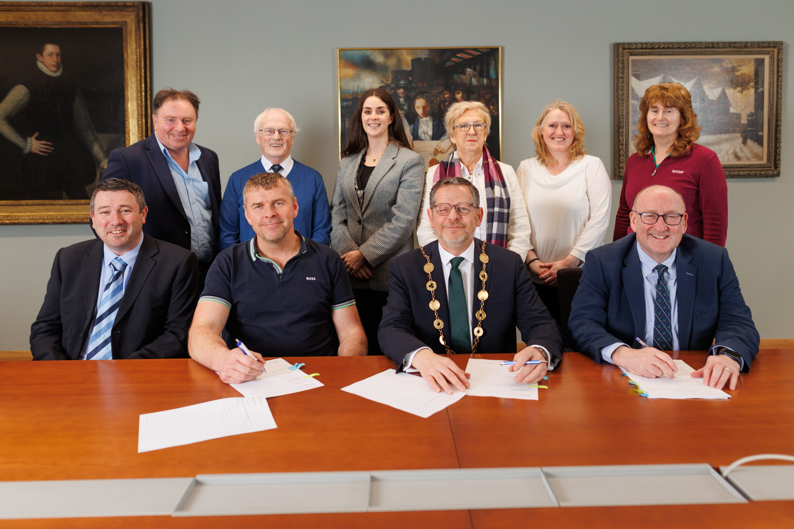 Mayor of Limerick, John Moran, and David McInerney, JADA Construction, sign contract for a housing development in Ballylanders. Also in the picture are Brendan Kidney, Senior Engineer, Dr. Pat Daly, Director General Limerick City and County Council, Councillors Tommy O'Sullivan and Eddie Ryan with Anna Donegan, Senior Executive Architect, Councillor Brigid Teefy, Yvonne O'Driscoll, Executive Architect and Caroline Curley, Director of Service.