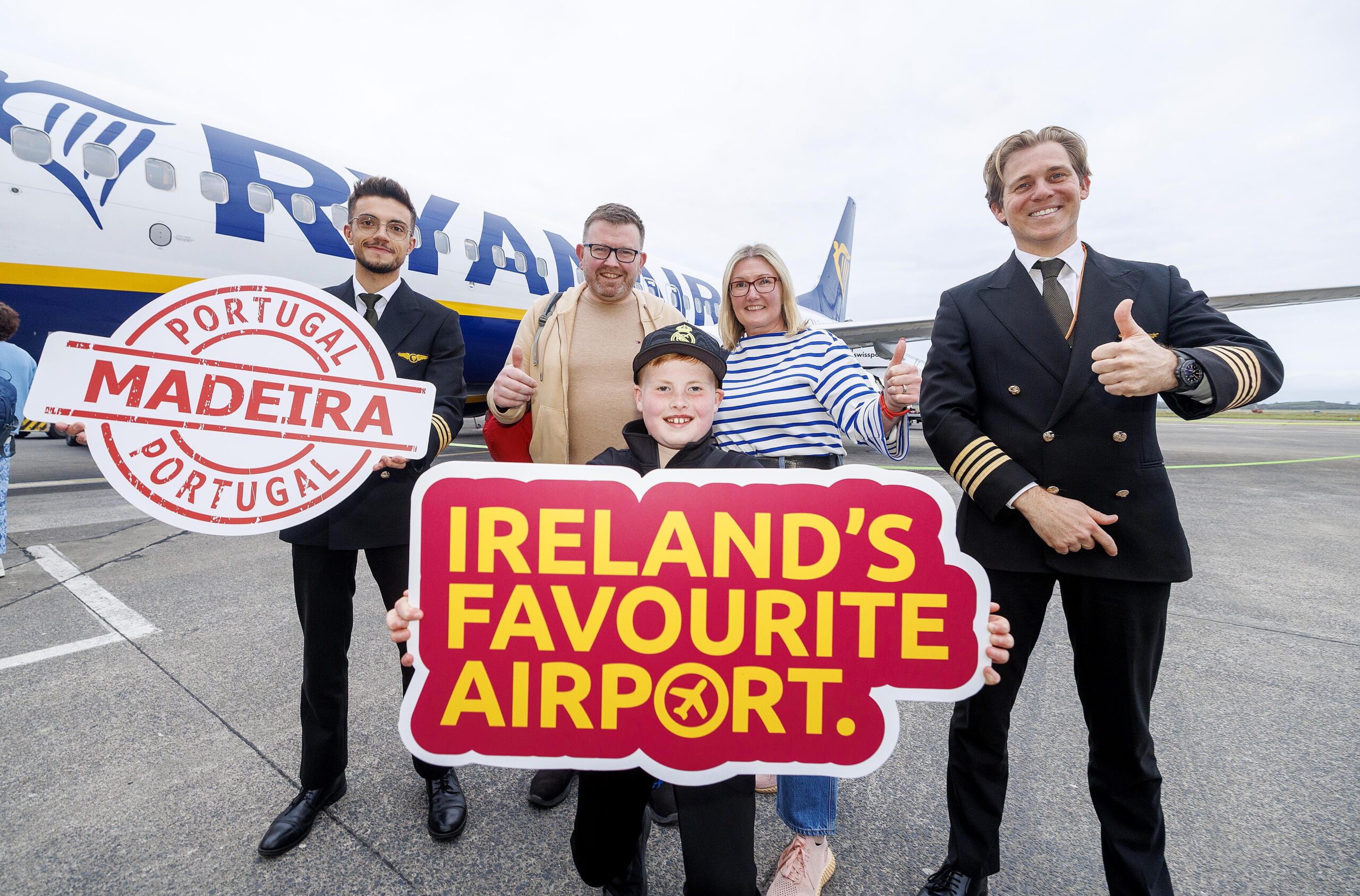 Shannon Airport has today (Monday 31st March ’25) unveiled its summer 2025 schedule, featuring two new services and a substantial increase of 190,000 seats, 11% ahead of 2024 services. This summer the airport will operate 36 services to 11 countries, including a brand-new twice weekly service to the Portuguese island of Madeira which celebrated its inaugural flight yesterday, and a new charter service to Palma with TUI, providing even more options for sun-seekers. This expansion aims to enhance travel options for passengers seeking city escapes and holiday breaks across Europe, the UK, and the USA. Pictured on the apron at Shannon Airport about to board their flight are Cranley family Hugh (9) with his parents Caroline and Eoin from Kildimo Co Limerick with First Officer Augusto Ferrara (left) who is from Medeira and Base Captain Justin Charbon. Pic Arthur Ellis