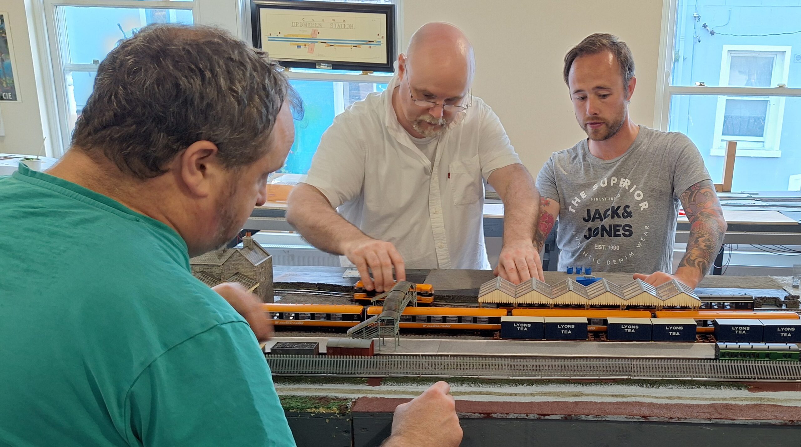 Mid-West Model Railway Club members Ed O'Leary, John White, and Evan Kelly discuss running orders and train compositions for their layout The Junction which will be unveiled at the Club's exhibition over the weekend of Saturday May 31st and Sunday June 1st in the Castletroy Park Hotel