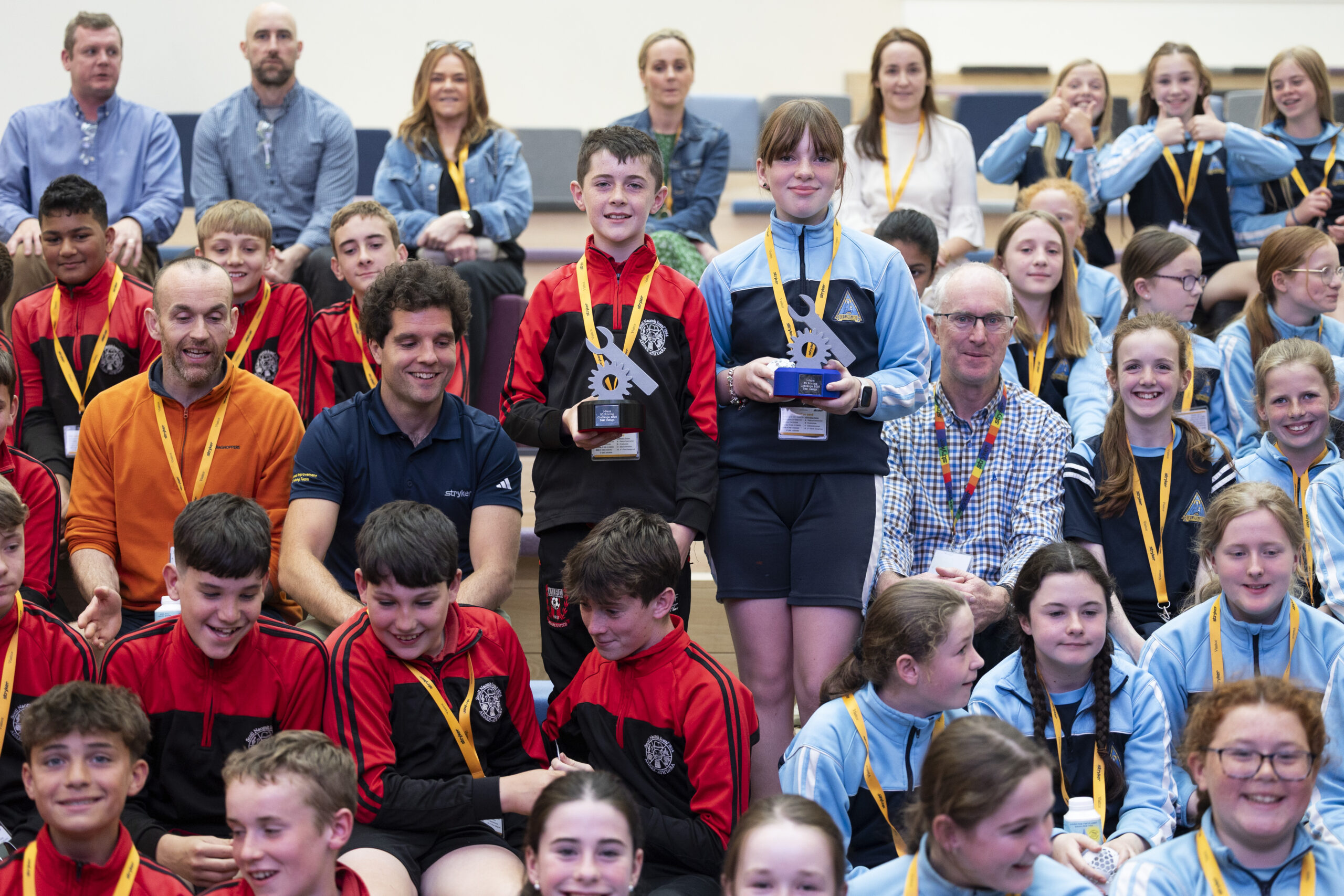 CMK 24062025 REPRO FREE NO FEE Limerick schools take top prizes in National 3D Printing Competition: Three Limerick primary schools - Our Lady’s Abbey, Adare, Scoil Naomh Iósaf, Adare and Croom National School - emerged as winners of this year's 'Manufacturing a Healthy Future' programme, a 3D printing design challenge which aims to foster STEM skills in classrooms. Organised by Stryker, a leading global medical technology company, in conjunction with I-Form, Science Foundation Ireland's Research Centre for Advanced Manufacturing, the 'Manufacturing a Healthy Future' programme has been working with primary school teachers since 2021 to empower them with the skills and 3D printing equipment necessary to bring manufacturing technology into their classrooms. Pictured are students from Our Lady's Abbey, Adare and Scoil Naomh Iósaf, Adare with their awards alongside Conor Tolan, Vice President Manufacturing JR at Stryker. Picture Clare Keogh