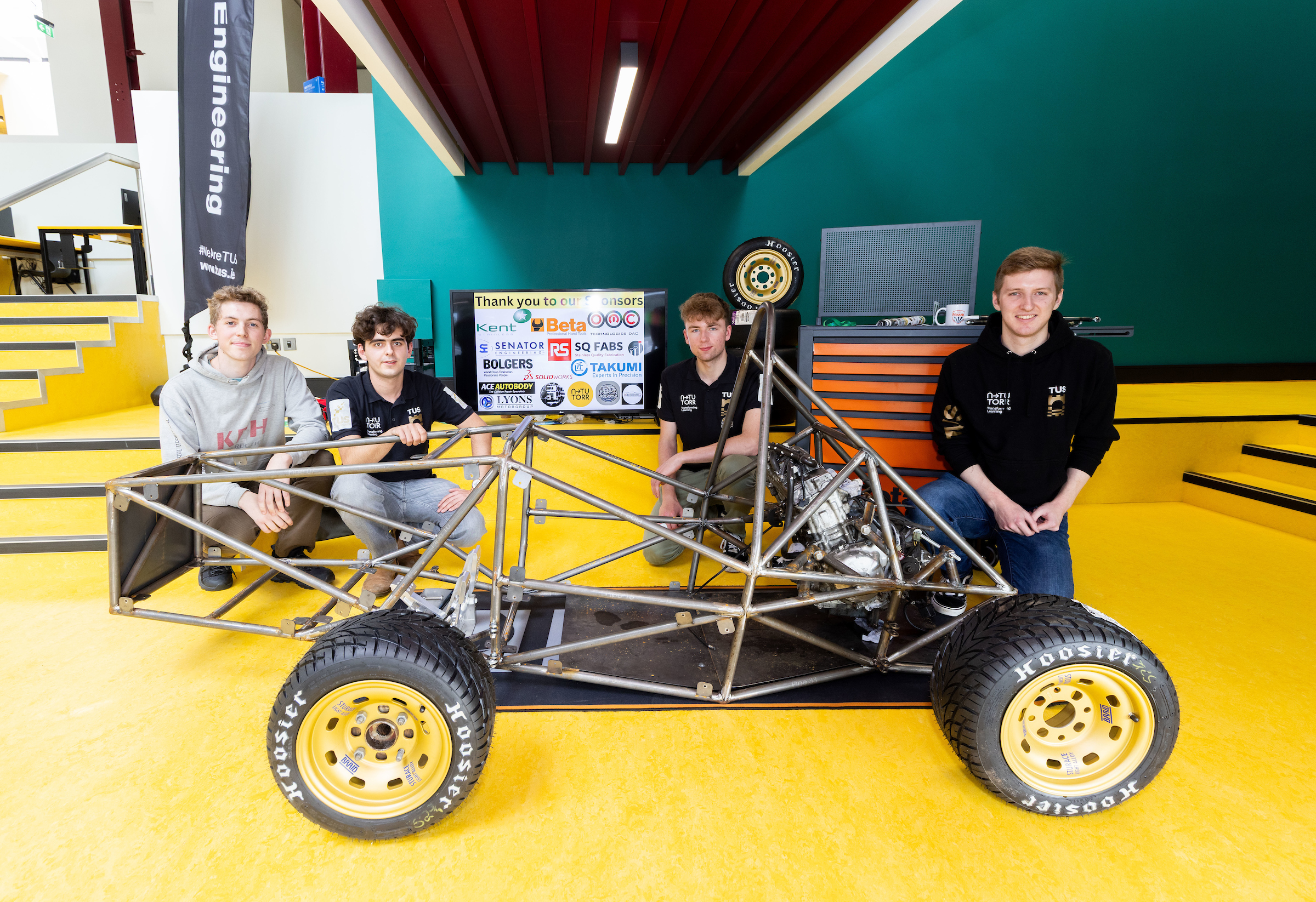 TUS Motorsports members Asher Grant, Nathan Killane, Daniel Gammell and Hugh O’Grady with the car which was on show at the Manufacturing Solutions exhibition at the Coonagh Campus. Picture: Alan Place
