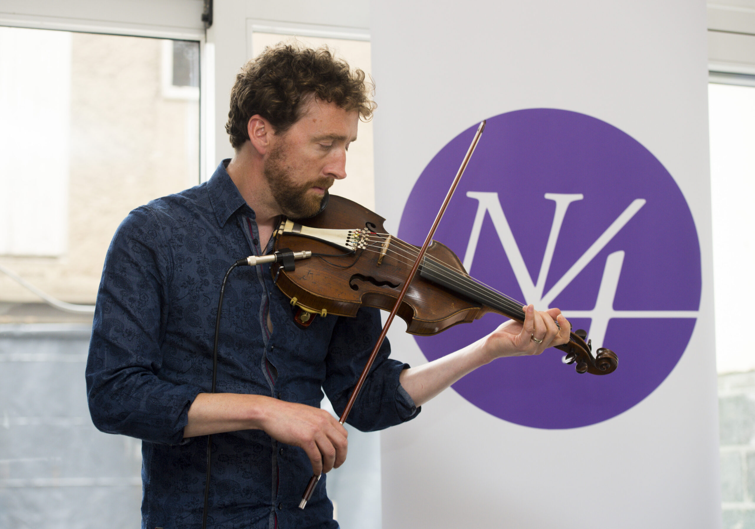 Narrative 4, a global non-profit that uses storytelling to promote empathy, exchange, and social change, launched their first global center in Limerick on the afternoon of June 27. Colm Mac Con Iomaire of The Frames performs during the launch of the Narrative 4 Global Centre. 58 O'Connell St, Limerick. Picture credit: Diarmuid Greene/Fusionshooters The afternoon featured readings by internationally renowned authors Colum McCann, Lila Azam Zanganeh, and poet Mary OÕMalley. It also showcased musical performances by violinist Colm Mac Con Iomaire Narrative 4Õs core methodology, the story exchange, asks participants to share stories and to step into each otherÕs perspectives to promote empathy. Co-founder Colum McCann explains, ÒThis is key to understanding the hopes, fears, experiences, beliefs, and world-views of others. ÊIt offers opportunities to recognize emotion in others and suggests that individuals refrain from judgment. ÊWe ask people to feel with and for others.Ó ÒNarrative 4 is based on the simple idea that by knowing the story of another, we are able to better understand each other,Ó said executive director Lisa Consiglio. Regional director James Lawlor added, ÒLimerick is the perfect place to be a global center for Narrative 4 to to help Limerick students engage in their communities and change the world.Ó Last year, over 25,000 stories were exchanged on four continents; the countries included Ireland, Mexico, Rwanda, Israel, South Africa, Palestine, England and the United States. Consiglio said, ÒIreland has given birth to some of the worldÕs finest storytellers. As we move to support both global and local actions towards change, we are excited to strengthen our organizational mission in Ireland by opening our first global headquarters in Limerick.Ó Narrative 4Õs 2016 summit began in Belfast on June 24, moved to Dublin and ends in Limerick on June 28. This yearÕs theme, ÒBroadening Our Reach,Ó will ask participants to focus on creating concrete actions to make change across communities.