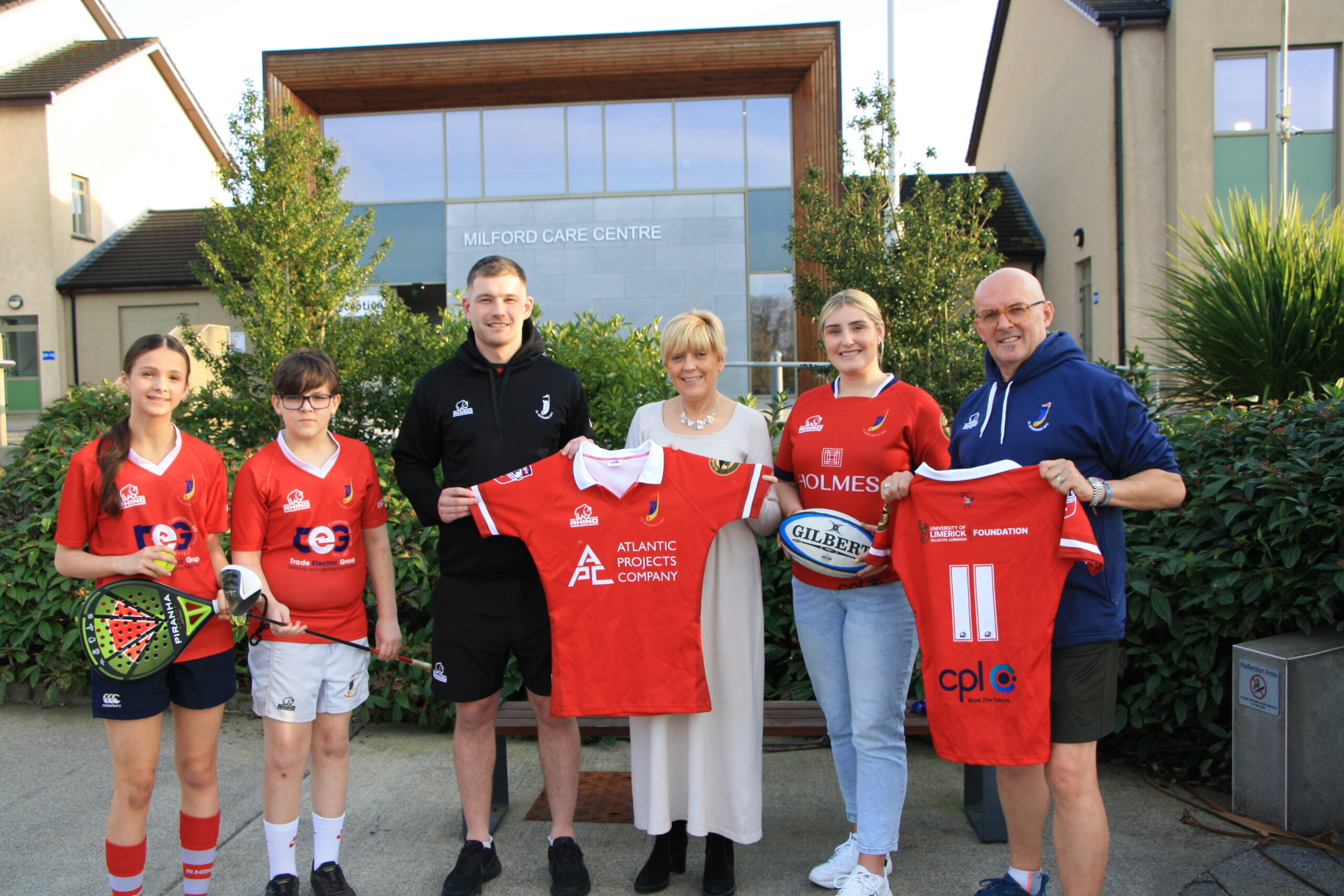 Anne Marie Hayes - Milford Care Centre Fundraising Manager picture with UL Bohemian RFC members and players. milford moveathon