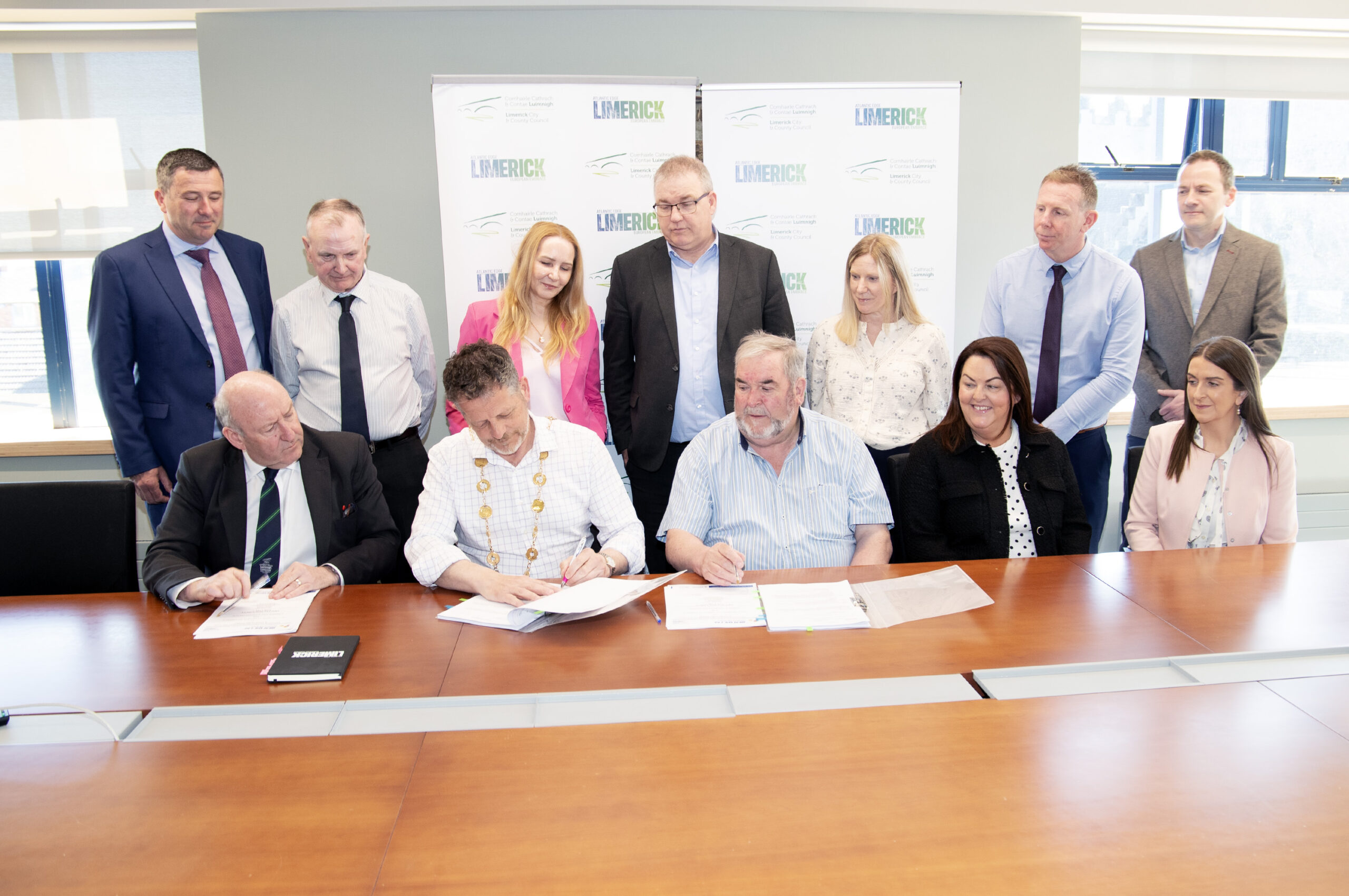 John Moran, Mayor of Limerick and Martin Loughnane, director, Martins Construction signing a housing construction contract with Martins Construction Ltd, for six single storey units at Mulcair Drive, Annacotty Co Limerick. Also in the photograph are back row from left Brendan Kidney, Senior Engineer, Limerick City and Co Council, Cllr Joe Pond, Cllr Elena Secas, Vincent Murray, Director of Economic Development, Limerick City and County Council, Miriam Donnelly, administration officer, Limerick city and county council, Derek Richardson, Project Manager, LA Housing Construction,Housing Development Directorate, Brian Ranahan, architect. Seated from left Dr Pat Daly, Director General, Limerick City and Co Council, Mayor John Moran, Martin Loughnane, Catherine Slattery , Príomh Chomhairleoir, Limerick city and Co. Council and Louise Loughnane, Director, Martins Construction. Photograph Liam Burke/Press 22