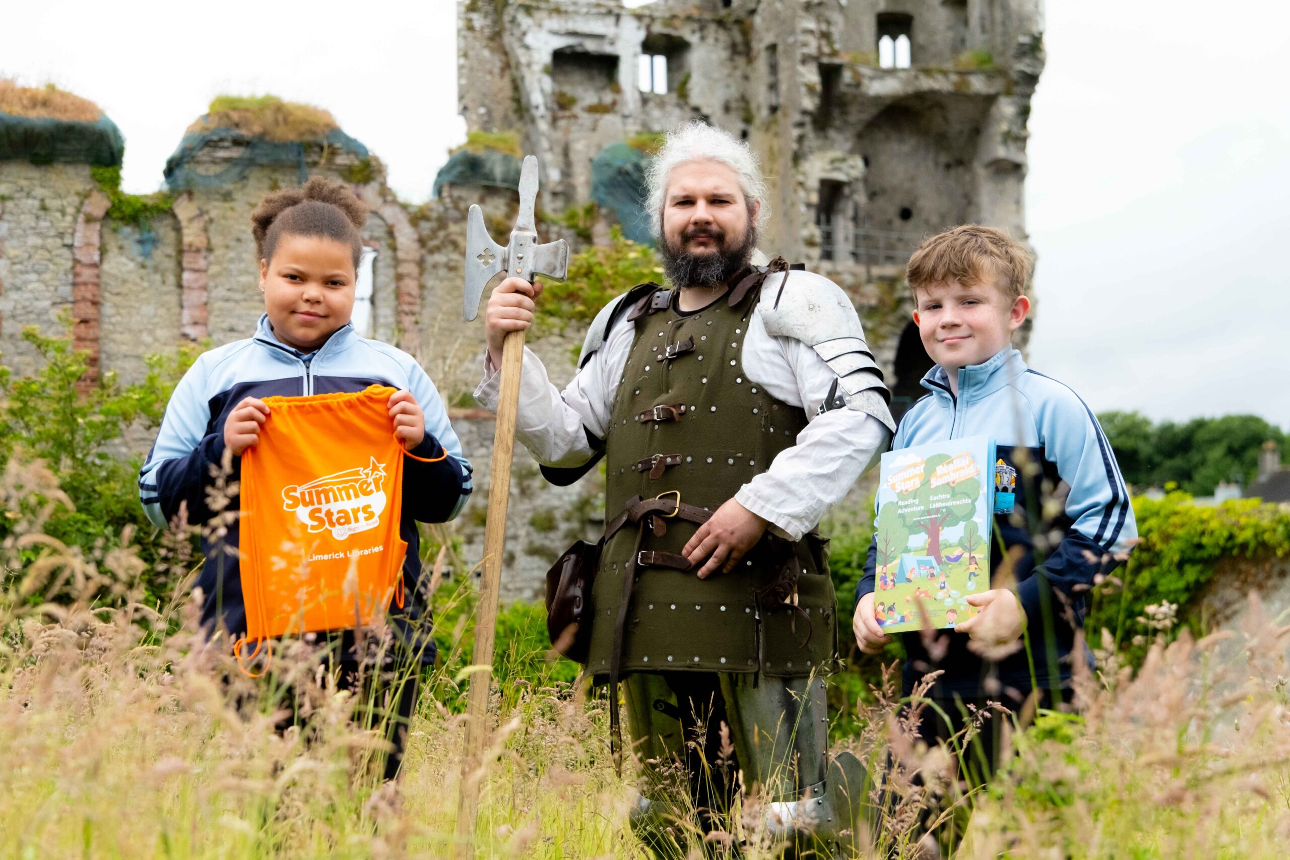 Kyah Ncube Murphy and Conor Fitzgerald from Scoil Naomh Muire Eas Géitine standing strong with Dylan from knightforhire.ie at the Askeaton Library to launch the Summer Stars Reading Programme. Photo by Paul Corey