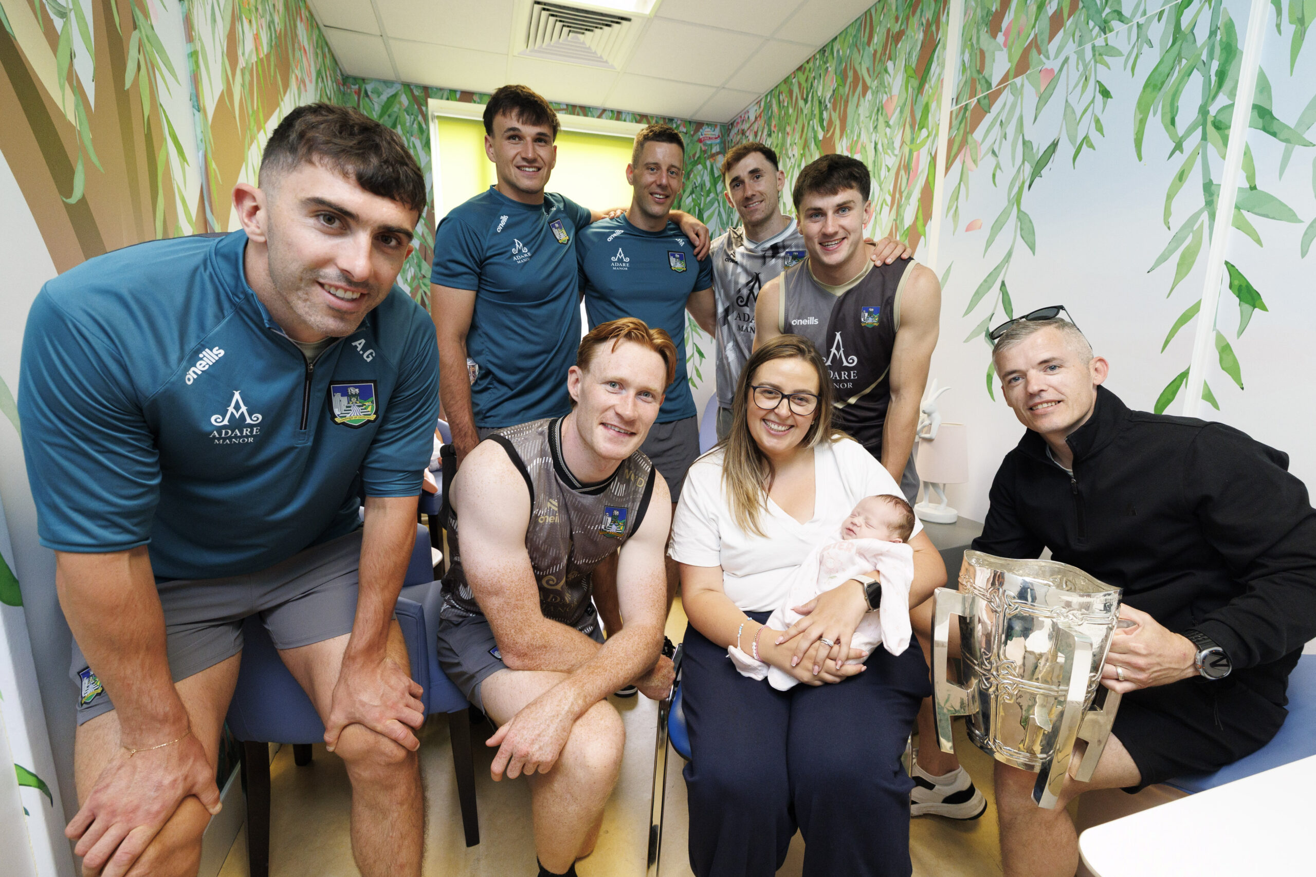 Pictured as the Limerick All Ireland Hurling Champions visit Crumlin Children’s Hospital with the Liam McCarthy Cup Sofia Dunne (3weeks) from Clondalkin with parents Colm and Karen. Picture Andres Poveda