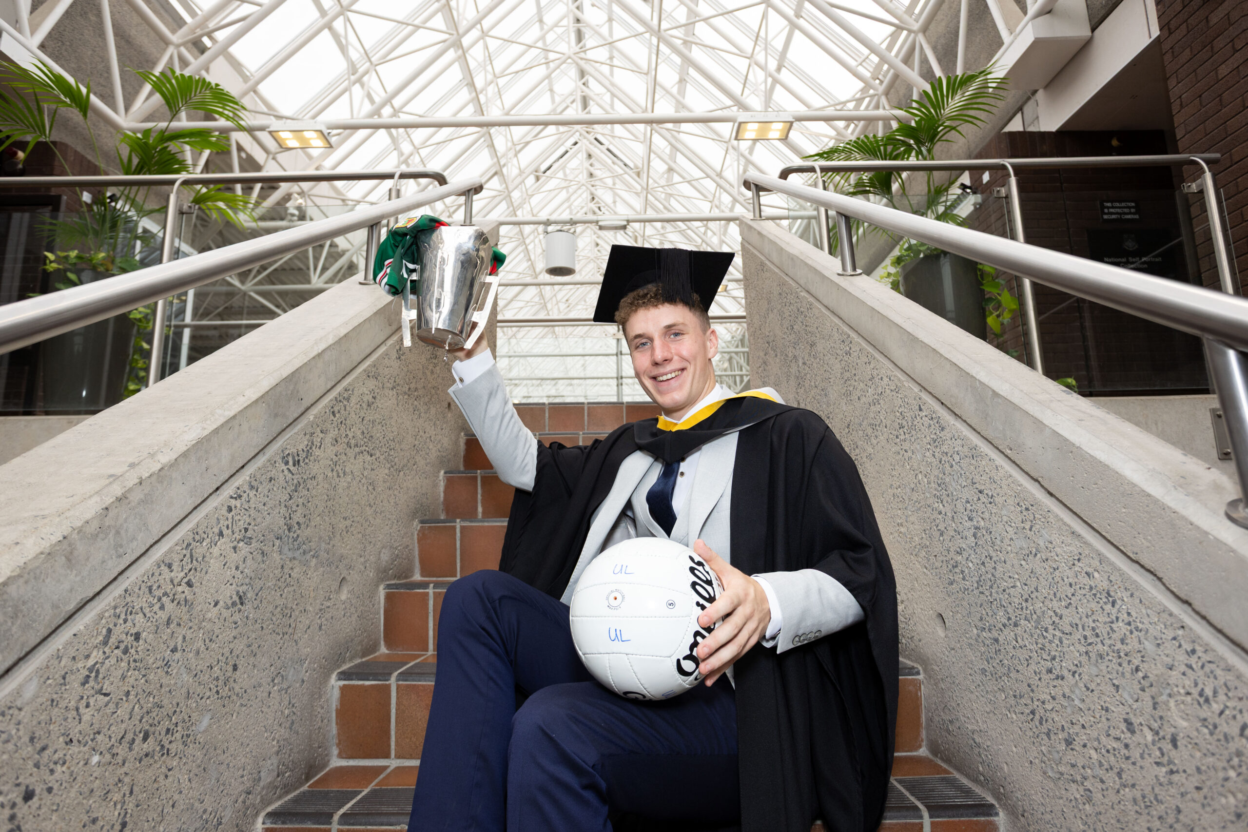 All-Ireland winning footballer Cian McHale, from Foxford in Co. Mayo, pictured at his graduation from University of Limerick. Cian was conferred with a Bachelor of Arts, joining more than 3,000 students receiving their degrees as part of the University’s autumn graduation ceremonies. Cian, who was also a star of UL’s historic Sigerson Cup win this year, is pictured with the trophy. Picture by Alan Place