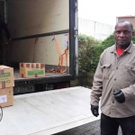 Patrick Lananga, volunteer, helping to load the second-hand books to Malawi at the Gateway to Education warehouse. Picture: Conor Owens/ilovelimerick.