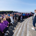 REPRO FREE
080624
Choirs led by acclaimed conductor Bernie Sherlock and members of New Dublin Voices perform against the iconic backdrop of the Cliffs of Moher as part of the annual Limerick Sings International Choral Festival running 7th - 9th June. PIctured is Bernie Sherlock conducting during their performance at the Cliffs of Moher in Clare. Pic Arthur Ellis.