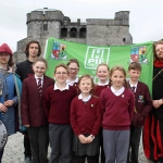 Sinestro the Jester, Mikey Casey and Jared Nadin with Martins Town primary school students at the Pay It Forward Limerick event at King Johns Castle on May 15 2018. Picture: Zoe Conway/ilovelimerick.