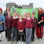 Sinestro the Jester, Mikey Casey and Jared Nadin with Martins Town primary school students at the Pay It Forward Limerick event at King Johns Castle on May 15 2018. Picture: Zoe Conway/ilovelimerick.