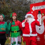 Santa and his two elves make their way to the Hunt Museum for the switching on of the Christmas lights. Picture: Cian Reinhardt/ilovelimerick