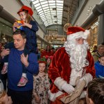Santa arrived at the Crescent Shopping Centre 
on Sunday, December 1st, 2024 and he greeted families at the Garryowen Mall entrance before leading a merry parade to his Grotto on City Mall. Picture: Olena Oleksienko/ilovelimerick