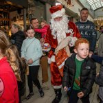 Santa arrived at the Crescent Shopping Centre 
on Sunday, December 1st, 2024 and he greeted families at the Garryowen Mall entrance before leading a merry parade to his Grotto on City Mall. Picture: Olena Oleksienko/ilovelimerick