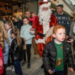 Santa arrived at the Crescent Shopping Centre 
on Sunday, December 1st, 2024 and he greeted families at the Garryowen Mall entrance before leading a merry parade to his Grotto on City Mall. Picture: Olena Oleksienko/ilovelimerick