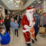 Santa arrived at the Crescent Shopping Centre 
on Sunday, December 1st, 2024 and he greeted families at the Garryowen Mall entrance before leading a merry parade to his Grotto on City Mall. Picture: Olena Oleksienko/ilovelimerick
