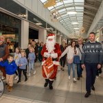 Santa arrived at the Crescent Shopping Centre 
on Sunday, December 1st, 2024 and he greeted families at the Garryowen Mall entrance before leading a merry parade to his Grotto on City Mall. Picture: Olena Oleksienko/ilovelimerick