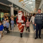 Santa arrived at the Crescent Shopping Centre 
on Sunday, December 1st, 2024 and he greeted families at the Garryowen Mall entrance before leading a merry parade to his Grotto on City Mall. Picture: Olena Oleksienko/ilovelimerick